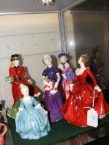 Five Royal Doulton figures including 'Christmas Da