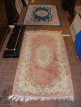 A small Chinese style rug and one other