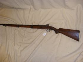 An antique percussion rifle with ramrod - overall