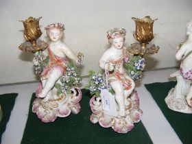 A pair of antique Continental ceramic candelabra -
