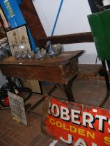 An unusual double seated school desk with lift up