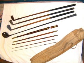 Hickory shafted golf clubs, together with a five piece vintage fishing rod