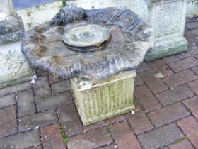 A shell shaped birdbath on column plinth - diamete