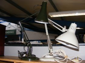 An Anglepoise lamp in black, together with one sim