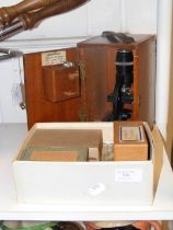 A vintage Britex Minor 3235 Microscope in wooden c