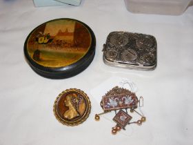 A small papier mache Russian snuff box, coin holde