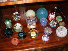 A selection of glass paperweights, including Isle