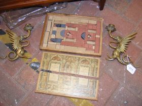 A pair of brass 'dragon' candlesticks, together wi