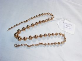 An unusual gold graduated 'ball' necklace