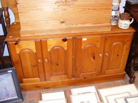 A pine sideboard with double cupboard - width 132cm