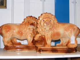 A pair of L & Sons lion indoor statues
