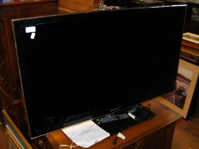 A Samsung 40inch TV with power cable and remote