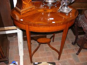 An oval Edwardian occasional table with intricate