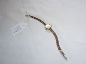 A ladies 9ct vintage watch with strap