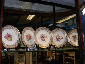 A set of six antique reticulated cabinet plates wi