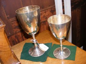 A 22cm high silver chalice and one other silver pl