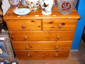 A pine chest of two short and three long drawers -