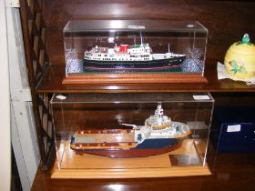 A model of Seacor Marine boat in glazed display ca