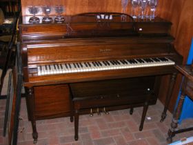 A Henry Herbert upright piano with stool