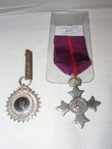 A First Type MBE with an Indian recruiting medal w