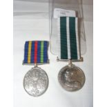 A Royal Naval reserve Long Service medal, together