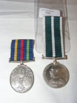 A Royal Naval reserve Long Service medal, together
