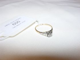 A diamond solitaire ring in gold setting