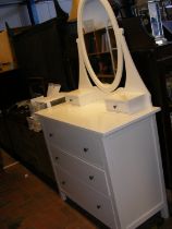 A contemporary white laminate dressing chest with