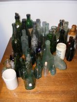 An assortment of stone and glass product bottles