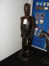 A carved wooden figure of Soldier - 52cm high