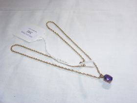 An amethyst pendant on gold chain