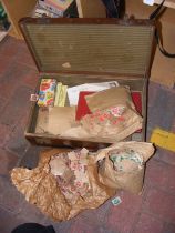 An old vintage suitcase full of loose, used stamps