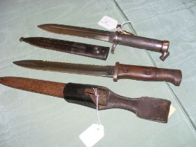 An EJ/AB bayonet in scabbard, together with one ot