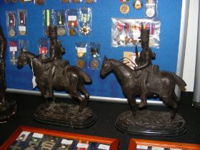 A pair of reproduction bronze Cavalry figures on h