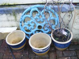 Three terracotta glazed pots, together with cast i