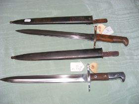 Two Elsener Schwyz bayonets in scabbards - one sli