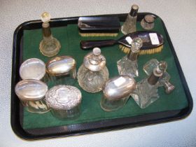 A selection of silver topped scent bottles and oth