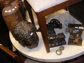 A bronzed plaster head sculpture, together with as