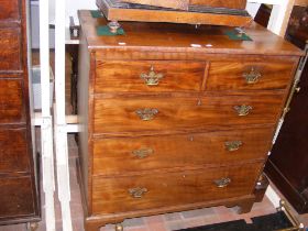 An antique mahogany chest of two short and three l