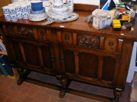 An oak Ercol sideboard - width 139cm