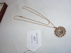 A gold farthing pendant on chain