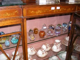 A collection of glass paperweights, including Isle