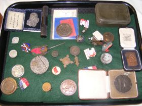 A selection of war badges, medals from around the