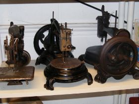 Three antique sewing machines