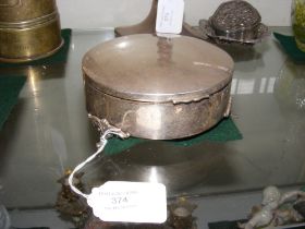 A circular silver jewellery box - 13cm diameter
