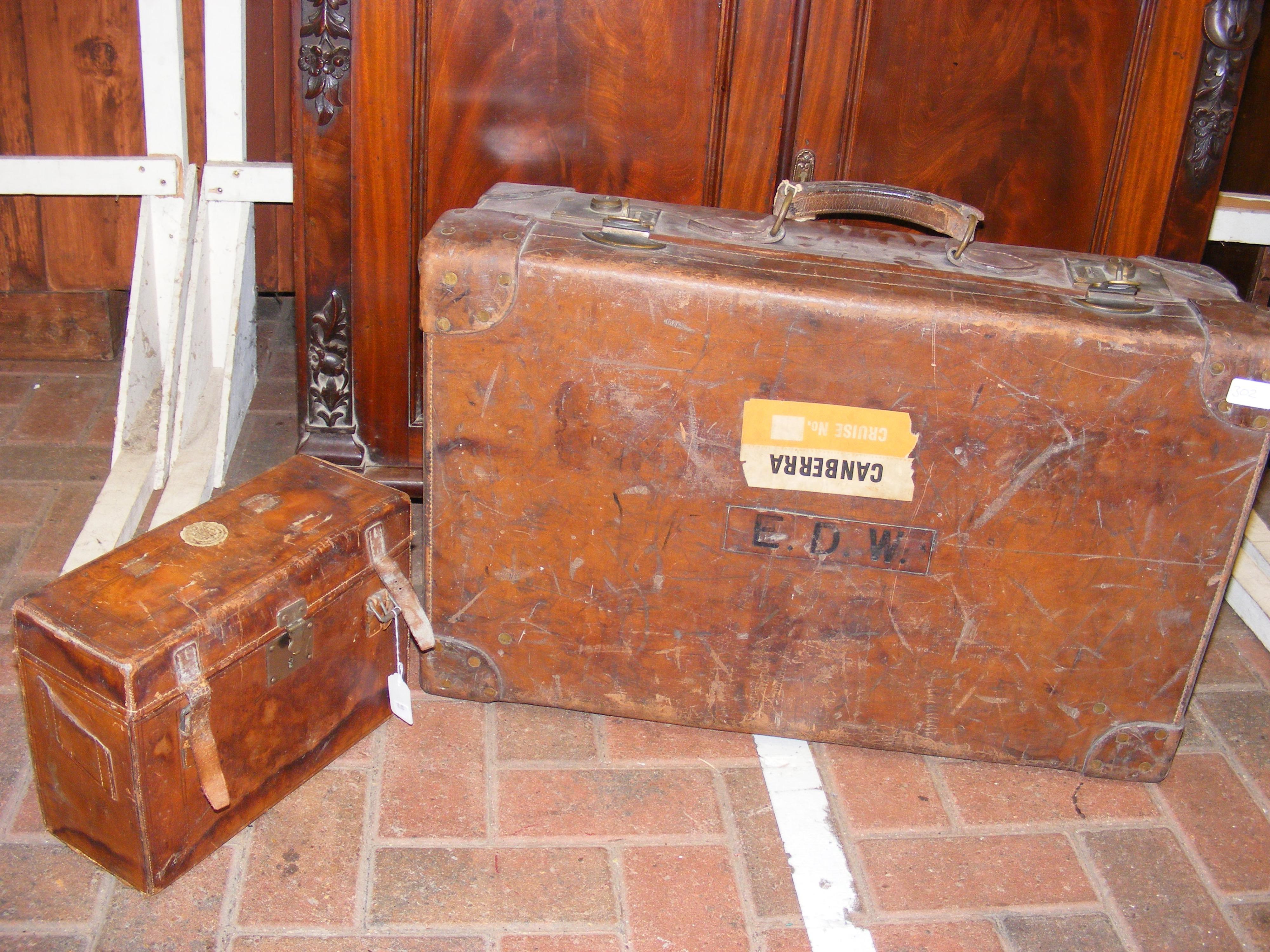 An antique leather shotgun cartridge case, togethe