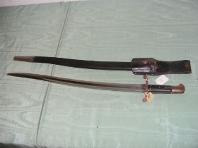 An antique sword bayonet in leather scabbard - len