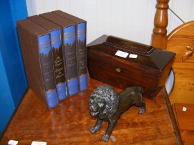 An antique tea caddy, cast metal lion and a set of