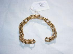 A designer gold link bracelet