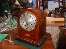 A inlaid mahogany mantel clock with three train mo